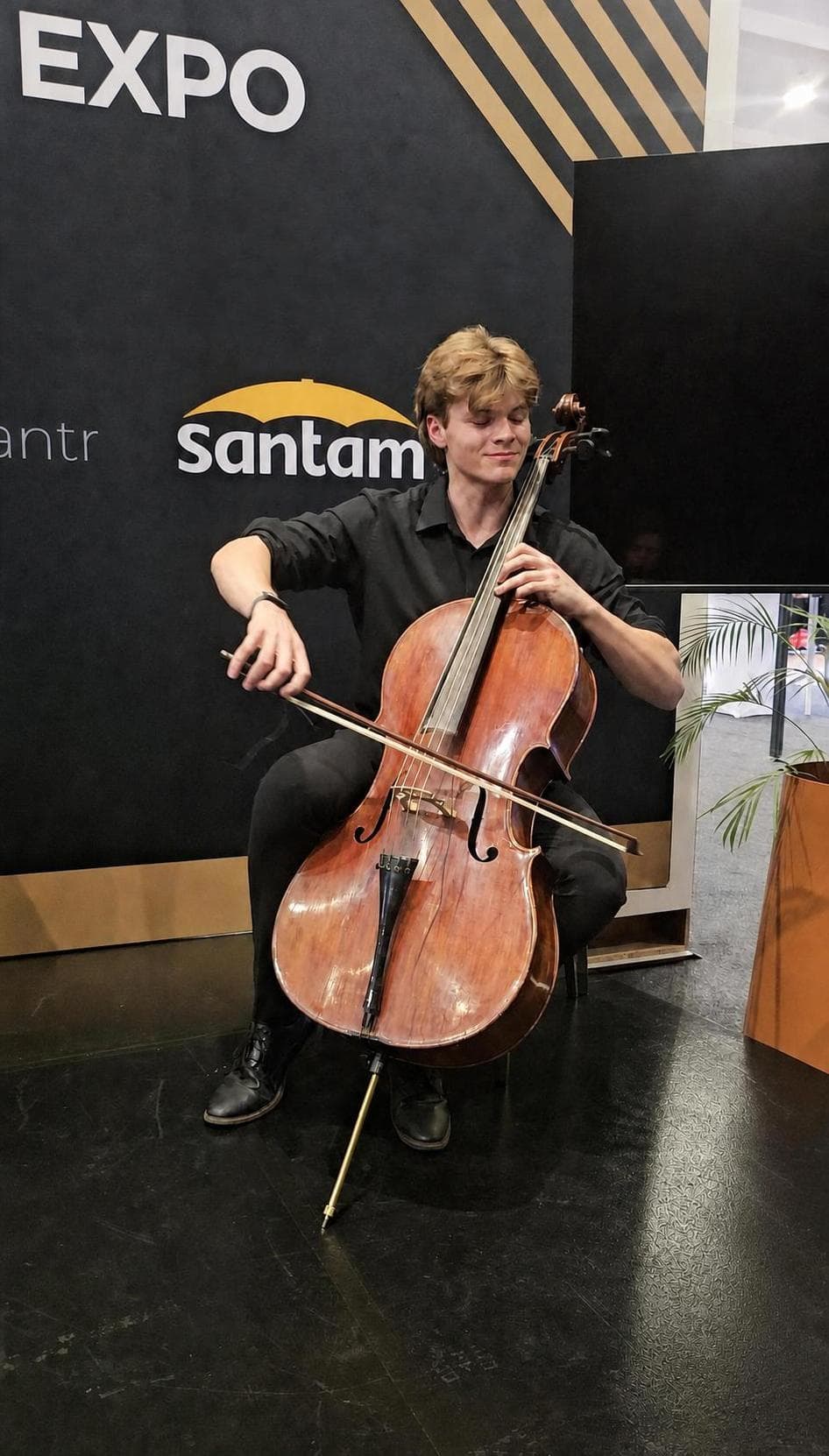 Luke Stamer performing cello at a corporate event